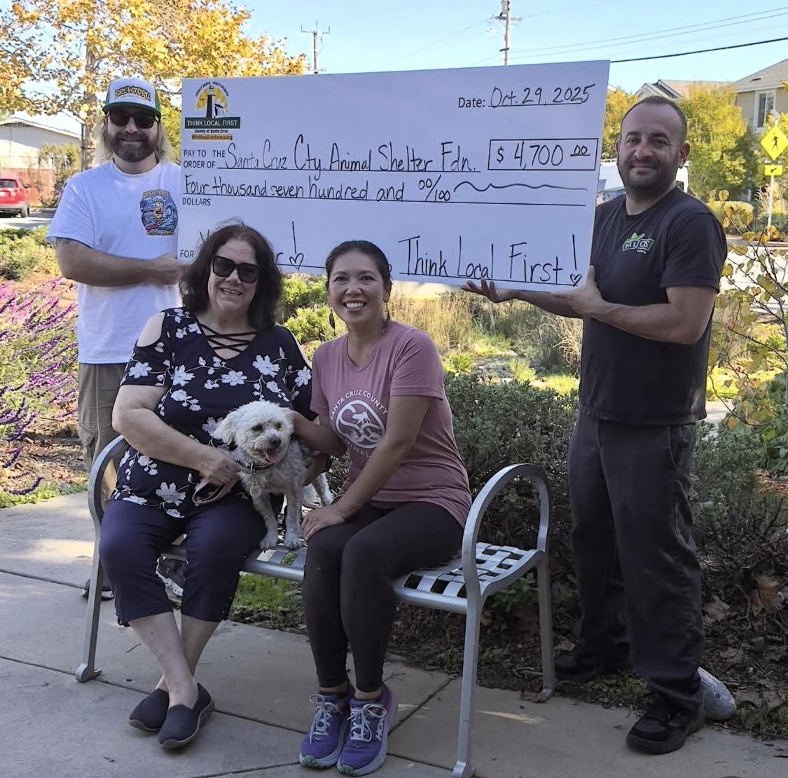 Cami presenting a $4,700 Think Local First donation check to the Santa Cruz County Animal Shelter Foundation